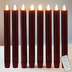 six candles with one lit and the other turned on