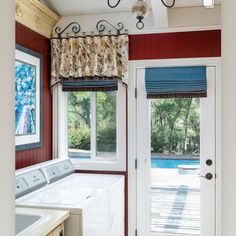 a washer and dryer in a room next to a window with the door open