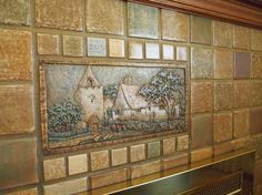 a tile mural on the side of a wall