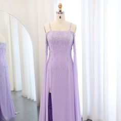 This Dreamy Vow Arabic Lilac Mermaid Evening Dress with Cape Sleeves SS448 is a luxury formal gown perfect for weddings and special occasions. The intricate beading and delicate lace details add a touch of elegance, while the mermaid silhouette and cape sleeves flatter the figure. Make a statement in this stunning dress. Elegant Mermaid Dress With Long Train For Banquet, Elegant Purple Bridesmaid Dress For Banquet, Fitted Purple Bridesmaid Dress For Banquet, Formal Gown With Detachable Train For Prom, Formal Gown With Detachable Train For Prom Season, Purple Fitted Bridesmaid Dress For Wedding, Fitted Purple Bridesmaid Dress For Wedding, Purple Evening Dress With Sweep Train For Banquet, Banquet Gown With Sweetheart Neckline And Sweep Train