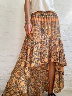 "This is very comfortable light and silky maxi skirt with high low deign  Delicate ruffles, true bohemian, gypsie style, with floral patterns  perfect holiday and party skirt  MEASURE size M elastic waist is 26\"-34\" length is 40\" More trendy boho ideas at  https://www.etsy.com/shop/AltheaStores? Thank You for looking" Bohemian Gathered Skirt For Summer, Flowy Ruffled Festival Bottoms, Summer Bohemian Ruffled Skirt, Bohemian Tiered Flowy Skirt, Flowy Ruffled Skirt Bottoms For Festival, Bohemian Tiered Maxi Skirt With Ruffle Hem, Bohemian Ruffle Hem Skirt, Bohemian Long Skirt With Layered Hem, Bohemian Ruffled Skirt For Summer