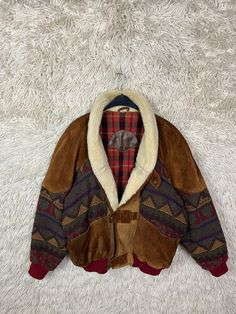 Vintage Navajo bomber jacket with teddy collar. Lined with wool flannel. Suede and wool. One pocket on the left and right, as well as an inside pocket, one with a zipper, one without. Colors: Cognac, Bordeaux, Anthracite, Purple, Green, Mustard Yellow Material: Suede, Wool-Acrylic-Mix, Lining: 100% Polyester Size Size M - XL Please note the dimensions! Length: 71 cm Width: 75 cm Arm length from collar: 83 cm If you have any questions or need further information, just write to me : ) Wool Flannel, Vintage Navajo, Mustard Yellow, Festival Season, Favorite Outfit, Art Collection, Bomber Jacket, Bathing Beauties, Jackets & Coats