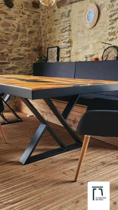 a wooden table sitting on top of a hard wood floor