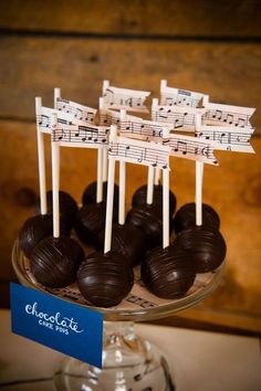 there are chocolates on sticks with music notes on them in the shape of sheet music