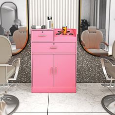 a pink cabinet sitting next to two mirrors in a room with chairs and hair dryers