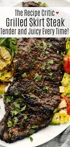 grilled steak served on a white plate with vegetables