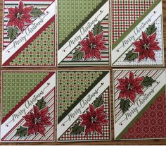 four christmas cards with poinsettis and holly on them, sitting on a wooden table