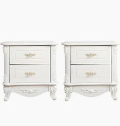 two white nightstands sitting next to each other