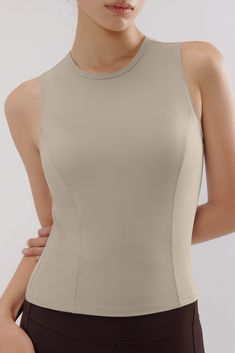 Simple and chic, our Mousse Cropped Sports Tank is designed to allow you to move to your own rhythm. Made from a sleek Mousse fabric that’s moisture-wicking and quick-drying, this top will work to keep you cool and comfortable in the gym or anywhere you go. Fit tip: if you're in between sizes, we recommend sizing up. Details Materials & Care Shipping & Returns • Sleeveless with a high neckline.• Features soft yet moisture-wicking Mousse fabric, designed to stretch with your every move.• Perfectl