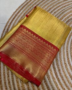 Golden yellow tissue silk saree with rich zari work and red border. The pallu is woven in red. The blouse piece is in red, same combination as the border and pallu. The saree is soft, drapes wonderfully, easy and comfortable to wear. It has a rich texture, and is suitable for ceremonies, parties and festivals. Goes really well with traditional earrings. Dimensions - 6.3m length, with 5.5m saree and 0.8m blouse piece in running material. Best quality. Red Saree With Golden Border, Yellow Tissue Saree, Red Saree Blouse, Tissue Silk Saree, Pattu Saree Blouse Designs, Tissue Saree, Yellow Saree, Saree Designs Party Wear, Red Border