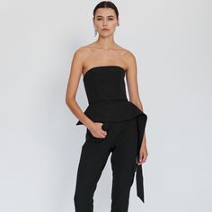 This strapless bustier has a corset-inspired shape that is fitted at the bodice.  It has a flattering peplum hem and a flowing panel at one side.  Its simplicity makes it incredibly easy to style. This seasonless piece is one of the wardrobe essentials.  It has a metal zipper closure at the back %64 Cotton %33 Nylon %3 Elastane Layered Drapes, Black Tapered Pants, 3d Printing Fashion, Black Bustier, Strapless Bustier, Pants Large, Peplum Hem, Tapered Pants, Mens Jewelry Bracelet