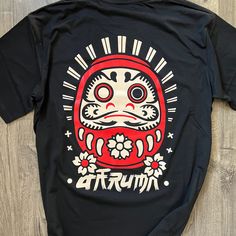 - 100% cotton - Pre-shrunk & Runs true to size - Shoulder-to-shoulder taping - Unisex size - Double-needle stitched sleeves and bottom hem - Quarter-turned to avoid crease down the middle Graphic Design Tee, Daruma Doll, Japanese Tshirt, Art Graphic Design, Graphic Tee Design, Tee Design, Asian Art, Gender Neutral, Graphic Tees