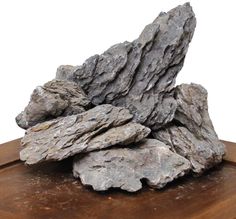 a pile of rocks sitting on top of a wooden table