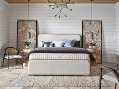 a bedroom with white walls and wooden ceiling