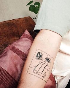 a person with a tattoo on their arm