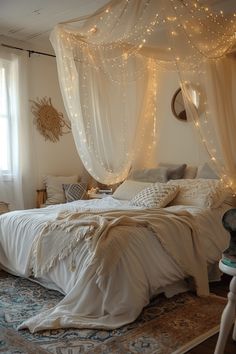 a bed with white curtains and lights on the headboard is in a room that has carpeted flooring