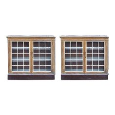 two wooden windows with glass panes on each side