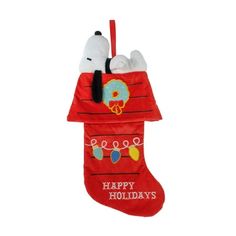 a christmas stocking with snoopy and doughnuts hanging from it's side