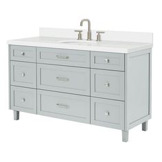 a bathroom vanity with two sinks and drawers