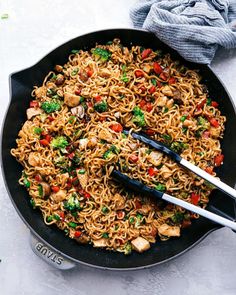 a skillet filled with noodles and vegetables