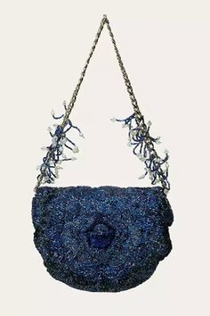 Midnight blue faux leather handcrafted and hand sewn rose pattern mini sling bag with luxe microfiber suede lining, all over hand work and detachable beaded shoulder strap.
Type: Hand Embroidered and Embellished
Composition: Faux Leather, Lining: Luxe Microfiber Suede
Color: Blue
Comes with detachable shoulder strap and extra metal chain strap
Silver hardware
Slip-in pockets
Heat embossed branding inside
Closure: Magnet button
No. of compartments: 3
Size LxHxD (in cms): 13x5x12 - Aza Fashions Fancy Purses, Mini Sling Bag, Grey Beads, Blue Handbags, Embroidered Bag, Handbags Online, Hand Work, Rose Pattern, Online Bags