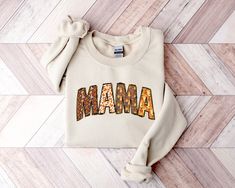 Mama Fall Sweatshirt, Fall Crewneck, Mama Sweater, Fall Sweater, Mama Crewneck, Fall Mama Shirt, Fall Mama Sweater This crewneck sweatshirt is pure comfort. Made from a soft cotton/poly blend with no itchy side seams, this is sure to become a staple. SIZE AND FIT: Your sweatshirt design will be printed on a high-quality, soft and comfortable unisex sweatshirt. Sizes run true to size, which takes the guesswork out of ordering; if you like your sweatshirts loose or oversized, you might want to ord Fall Mama Sweatshirts, Fall Crewneck, Mama Crewneck, Mama Sweater, Fall Sweater, Mama Sweatshirt, Fall Sweatshirt, Mama Shirt, Fall Sweaters