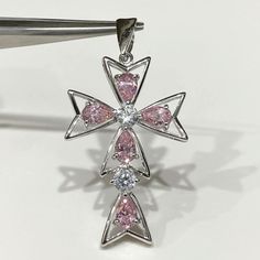 Vintage Sterling Silver Pink Sapphire & White Topaz Cross Pendant...Marked 925...Total of weights 5.2grams...Measure includes the Bail H 1 6/8'' W 1''...It's in very good condition. Sterling Silver Jewelry With Diamond White Stones, Pink Sterling Silver Jewelry With Stones, Pink Cross Sterling Silver Jewelry, Pink Sterling Silver Cross Jewelry, Pink Cross Jewelry For Wedding, Silver Cross Jewelry With 17 Jewels, Dot Ring, Filigree Ring, Domed Ring