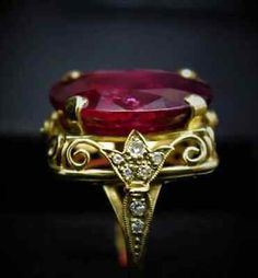 Oval Ruby Ring With Diamond, Exquisite Oval Ruby Ring With Center Stone, Exquisite Oval Ruby Ring, Exquisite Oval Diamond Ring With 17 Jewels, Red Oval Diamond Ring, Heirloom Oval Diamond Ruby Ring, Luxury Oval Collectible Rings, Collectible Yellow Gold Oval Rings, Exquisite Yellow Gold Oval Ruby Ring