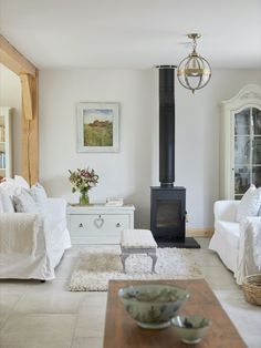 a living room filled with furniture and a fire place