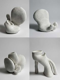 four different views of an animal made out of knitted material, each with its tail curled up