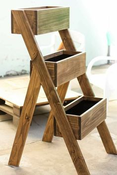 a wooden step stool sitting on top of a floor