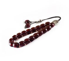 "Handcrafted Komboloi - Worry Beads made of high quality acrylic beads in burgundy color and silver tone metal Master Bead. This durable and pocket sized Komboloi is ideal for everyday use for passing time and relaxation. It would also be great for gift giving. Item can be made with different cord color. Please choose the cord color you would like from the drop down menu. Features: Item Length: approx. 26cm / 10\" Bead Size: 13x13mm / 0.50x0.50\" Bead Type: Acrylic Bead Color: Burgundy - Dark Re Adjustable Polished Amber Beads, Worry Beads, Popular Necklaces, Red Bead, Prayer Beads, Burgundy Color, Necklace Sizes, Acrylic Beads, Metal Beads