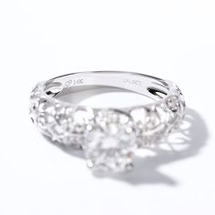 three stone diamond ring on white background