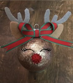 a christmas ornament with a reindeer's face on it