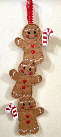 a group of gingerbreads hanging from a wall