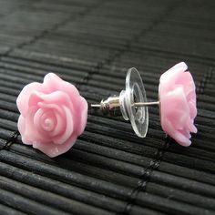 Silver tone post earrings (no nickel) are combined with pretty handmade resin roses in a soft shade of blush pink. The pair also comes with a matching set of silver tone earring backs. Size: 14mm roses These earrings are available in a variety of colors! http://etsy.me/1rv1YFV They are also available as dangle earrings! Bronze - https://www.etsy.com/stumblingonsainthood/listing/106361809 Silver - https://www.etsy.com/stumblingonsainthood/listing/113486696 If you would like to order a larger quan Pink Rose Flower Earrings For Gift, Pink Flower Earrings With Rose Design, Rose Flower Earrings For Pierced Ears, Pink Resin Flower-shaped Earrings, Pink Rose Earrings, Earrings Flower, Earrings Stud, Flower Jewelry, Rose Earrings