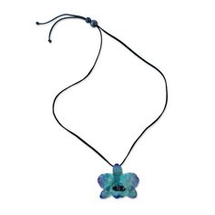 The beautiful flower is preserved through an elaborate electroplating process, which coats it in shining resin to display its dyed blue hues. Local Thai artisans carefully select a natural orchid flower, ensuring its quality. Adorning the neck on a length of leather cord, this pendant necklace features an adjustable length with sliding glass beads. Dyed natural orchid in resin, leather cord, glass beads Adjustable Handmade in & fairly traded from Thailand Due to the natural materials in this Orchid Pendant, Orchid Necklace, Paw Print Jewelry, Spirit Clothing, Ribbon Jewelry, Printed Jewelry, Flip Flop Shoes, Backdrop Decorations, Orchid Flower