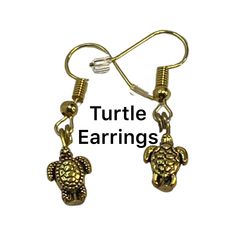 Turtle Earrings, Tortoise Charms, Turtle Charms, Gold Turtle Earrings, Dangling Turtle Earrings, Tortoise Earrings, Turtle Charms by BecSueJewelryShop on Etsy Tortoise Earrings, Ammolite Jewelry, Jewelry Promotion, Earrings Dangling, Jewelry Board, Turtle Charm, Turtle Earrings, Feather Jewelry, Moonstone Bracelet