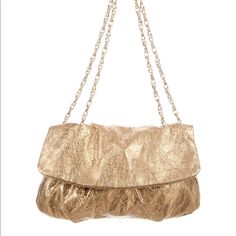 Elie Tahari Gold Crossbody Bag. Style- Emory. Shoulder Strap Drop- 12" Height- 7" Width- 12" Depth-3". Beautiful Golden Elie Tahari Bag With Gold Chain, Perfect For An Evening/Formal Occasion Or Even Can Go With Some Denim And A Cute Top! I Wish I Had Use For This Bag But I Just Don't. Brand New With Tags, Retail Is $348.00! Gold Satchel Bag With Fold Over Clasp, Gold Flap Shoulder Bag For Evening, Gold Crossbody Shoulder Bag With Fold Over Clasp, Gold Shoulder Flap Bag For Evening, Gold Leather Flap Bag With Dust Bag Included, Gold Crossbody Satchel With Dust Bag, Chic Gold Pouch Flap Bag, Gold Flap Clutch Bag With Detachable Handle, Everyday Gold Shoulder Bag With Magnetic Closure