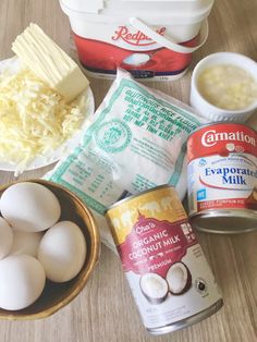 eggs, butter, yogurt, and other ingredients are on a wooden table