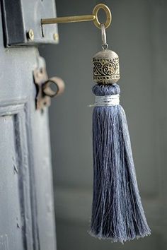 a door handle with a tassel hanging from it