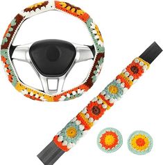 the steering wheel cover is decorated with multicolored crocheted flowers and has two matching buttons