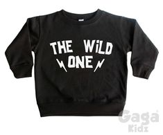 'The Wild One' kids black sweatshirt. ** Our sweatshirts fit true to size but we always recommend ordering a size bigger just to make sure ** Age / Size - Standard Universal Sizes * 6-12 Months / 17-24 Lbs * 1-2 Years / Chest (to fit): 22 inch * 2-3 Years /Chest (to fit): 24 inch * 3-4 Years / Chest (to fit): 26 inch * 4-5 Years / Chest (to fit): 27 inch * 5-6 Years / Chest (to fit): 28 inch * 7-8 Years / Chest (to fit): 30 inch * 9-11 Years / Chest (to fit): 33 inch * Made from soft heavyweight Black Band Merch Sweatshirt With Slogan, Unisex Black Crew Neck Sweatshirt, Black Crew Neck Sweatshirt With Lettering, Black Cotton Sweatshirt With Lettering, Black Slogan Sweater For Streetwear, Black Band Merch Sweatshirt Pre-shrunk, Black Band Merch Sweatshirt, Pre-shrunk, The Wild One, Black Sweatshirt