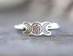 This listing is for one adorable sterling silver moon phase ring. The unique witchy ring features a fun moon phase with double eyes and laurels and a star at the center of its forehead. It's so unique and fun! The focal piece is hand stamped and fired onto sturdy 14 gauge sterling silver wire. Wear this ring solo or wear it stacked with several hammered bands for an edgier, bohemian style! Perfect gift for any witchy woman! - Choose your ring size and stacking options at checkout!  - Triple Moon Adjustable Magical Jewelry With Sun And Moon Design, Adjustable Magical Sun And Moon Jewelry, Mystical Adjustable Moon Phase Rings, Spiritual Silver Ring With Moon Charm, Bohemian Silver Moon Charm Ring, Bohemian Silver Ring With Moon Charm, Bohemian Adjustable Rings With Moon Charm, Mystical Silver Rings With Moon Phase, Silver Mystical Moon Phase Ring