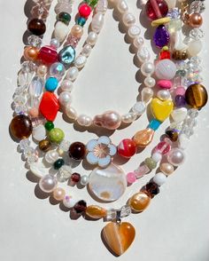 Fixing our sweet tooth with these Organic BONBON Candy Necklaces! This special series is handmade with all semi-precious and precious stones such as natural agates, tiger’s eye gemstone, mother of pearls, and vintage glass beads we collect over the years. We will add new pieces from time to time! Limited quantities for these healthy "sweets" (Not actually edible, of course). All necklaces measure at about 16" long with a gold-plated circle clasp. Chunky Bead Necklaces Aesthetic, Cool Pearl Necklace, Statement Beaded Necklace, Chunky Colorful Jewelry, Cool Beaded Necklaces, Glass Bead Crafts Jewellery, Maxamilist Jewelry, Glass Beaded Necklace, Hsr Redesign