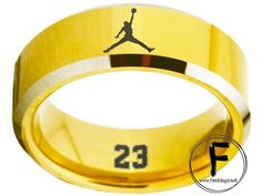 Air Jordan Ring #airjordan #jordan #michaeljordan #chicago #bulls #nba #nike #basketball #jumpman This is an absolute must-have for any and all Air Jordan fans! This ring is perfect for the fan who wants to flaunt their support and pride for their player and brand. The pictures do not do this ring any justice, it is soo eye-catching in real life, it will surely turn heads and be the cause of envy. You will not be disappointed! Made of HIGH-QUALITY Tungsten Carbide (Superior to the cheaper Stainl Tungsten Ring, Nike Basketball, Tungsten Carbide, Chicago Bulls, Ring Gold, Gold Ring, Air Jordan, Real Life, Air Jordans