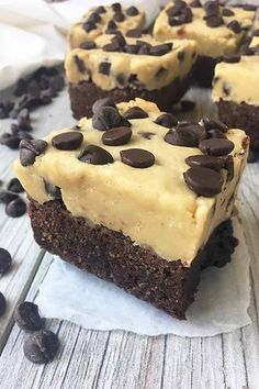 chocolate brownies topped with frosting and chocolate chips