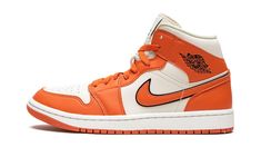 The Women’s Air Jordan 1 Mid “Sport Spice” is a women’s-exclusive colorway of the casual shoe with a premium and eye-catching construction.  The “Sport Spice” is complete with a Coconut Milk leather base with Sport Spice (orange) leather overlays featuring a pebbled basketball-like texture.  An orange leather Swoosh with black trim appears on the sides and “Wings” branding is found on the collar.  Classic Jumpman detailing dots the tongue. Womens Air Jordan 1, Womens Air Jordan, Air Jordan 1 Mid Se, Custom Made Shoes, Nike Air Jordan 1 Mid, Womens Air Jordans, Stadium Goods, Casual Shoe, Nike Air Jordan 1