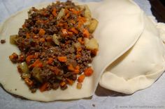 some food is sitting on top of a piece of wax paper and ready to be eaten