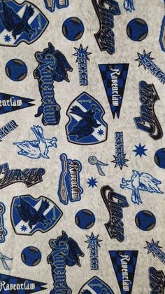 the blue and white fabric has many different sports logos on it, including one for the team